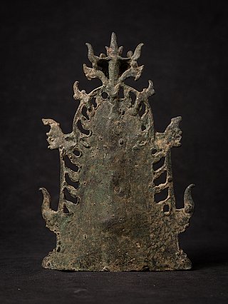 Rear view of the Pyu bronze Buddha statue showing the openwork halo backplate