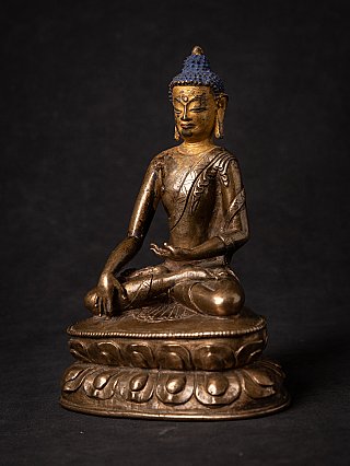 Tibetan bronze Buddha statue in bhumisparsha mudra, three-quarter view