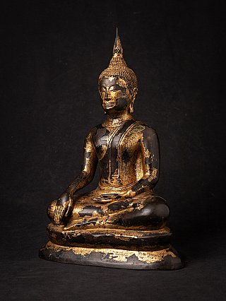 Bronze Buddha statue from Thailand with worn gilding, three-quarter left view