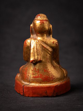 Burmese wooden Buddha statue, gilded, rear view showing robe folds
