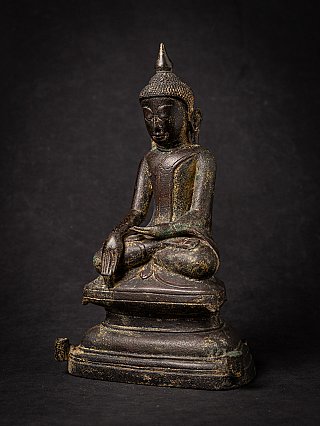Burmese Shan bronze Buddha statue, three-quarter left view showing the seated posture and base