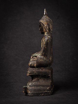 Shan Burmese bronze Buddha statue, left side profile with the pointed ushnisha and stepped base