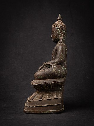 Seated Burmese Shan Buddha statue in bronze, left side profile view with green patina