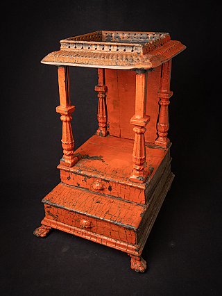 Wooden Indian temple shrine with roof and pillars, high three-quarter view