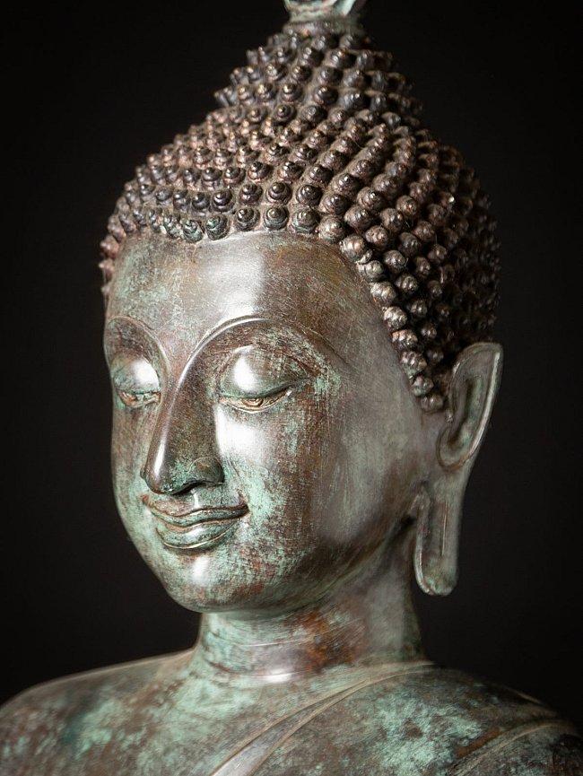 Old standing bronze Thai Buddha statue from Thailand