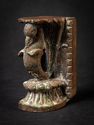 Antique Indian wooden temple fragment with bird bracket, left side view