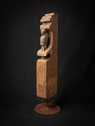 Antique Indian wooden temple fragment on stand, angled view showing niche and small figure