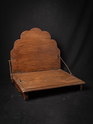 Antique wooden Indian throne, 19th century, three-quarter view with back panel and seat