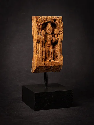Parvati wooden relief panel from India on metal mount and black base, angled front view