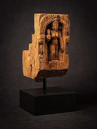 Wooden Parvati panel from India on stand, three-quarter left view