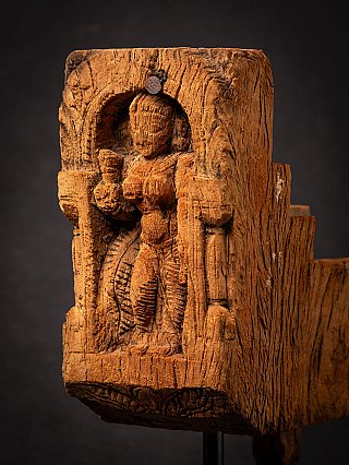 Antique Parvati wooden panel close-up in three-quarter view showing the depth of the niche