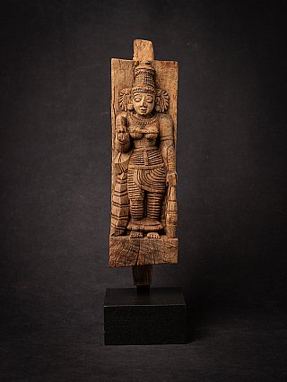 Wooden panel of the goddess Devi from India, standing relief shown from the front on black base