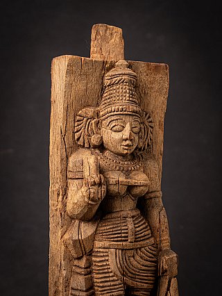Detail of Devi’s head and upper body on the wooden panel, with tall headdress and jewellery
