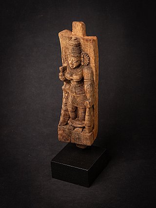 Wooden Devi panel on a base, angled view from above showing the full figure