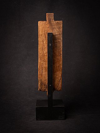 Rear view of the antique Devi wooden panel from India with mounting on a black stand