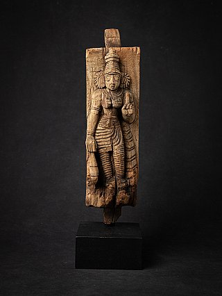Wooden relief panel of the goddess Devi from India, full front view on black base