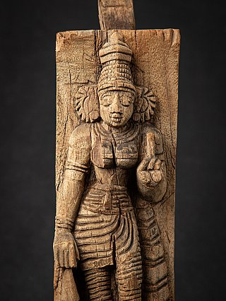 Close-up of the Devi wooden relief panel, frontal view with hand gesture and carved folds