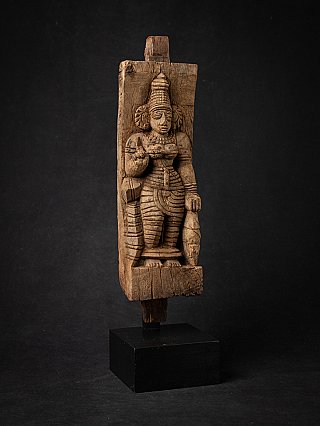 Wooden panel with the goddess Devi, front view slightly angled on black stand