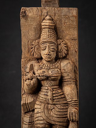 Close-up of Devi on the wooden relief, frontal face with necklace carving