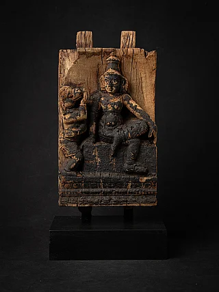 Antique Indian wooden panel with standing Hindu deity relief and attendant, front view