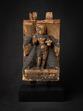 Antique wooden panel from India with standing Hindu god in relief, full front view