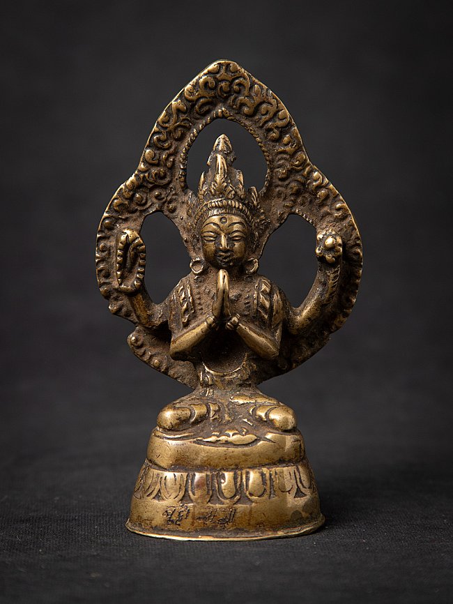 Chenrezig Buddha statue in bronze from Nepal, seated with namaskara mudra, front view