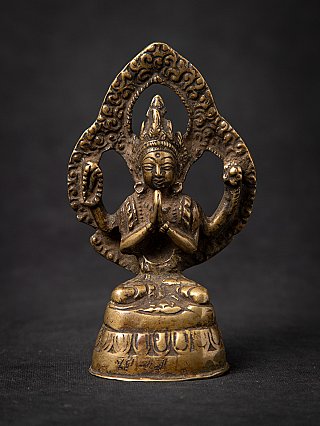 Chenrezig Buddha statue in bronze from Nepal, seated with namaskara mudra, front view