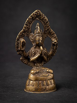 Chenrezig Buddha statue in bronze from Nepal, three-quarter view with crown and patterned halo