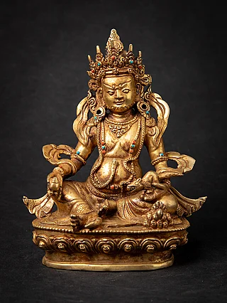 Nepali bronze Kuber statue seated on an ornate base, full front view