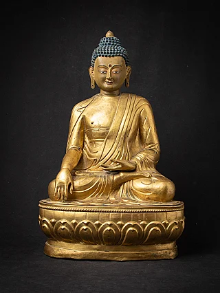 Tibetan wooden Buddha statue seated in bhumisparsha mudra, full front view