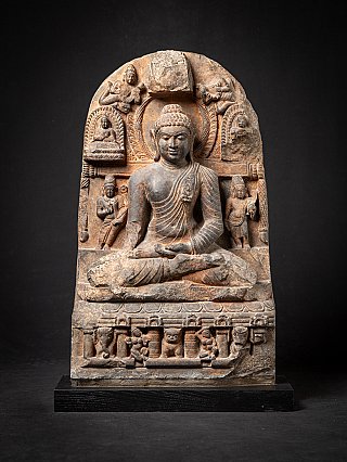 Buddha statue in Pala style from India, seated on carved base with stele, full front view