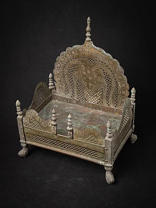 Antique Indian throne, three-quarter view with pierced backplate and side panels