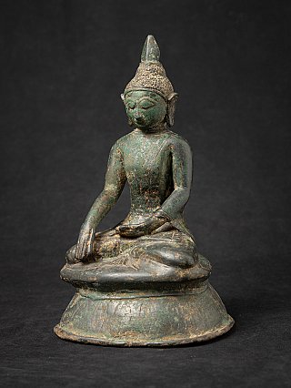 Bronze Buddha statue from Burma, three-quarter view showing the rounded base