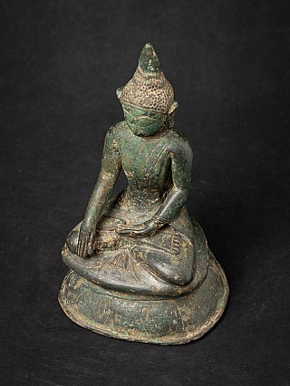 Top-down view of the seated Burmese bronze Buddha statue in bhumisparsha mudra
