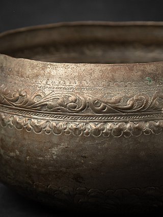 Close-up of the engraved scroll band on the silver-plated Burmese offering bowl