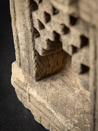 Angled close-up into the niche showing interior surface and ledge