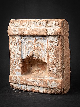 Indian stone temple shrine, three-quarter view showing the depth of the recessed niche