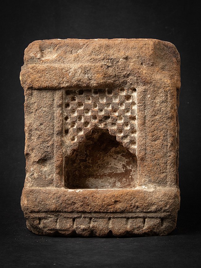 Antique Indian sandstone shrine with recessed niche and grid-carved back panel, front view