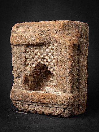 Indian sandstone shrine in three-quarter view showing the niche and right side
