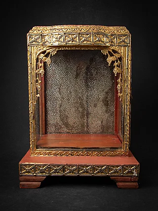 Antique wooden Burmese temple shrine with gilt frame, front view of open niche