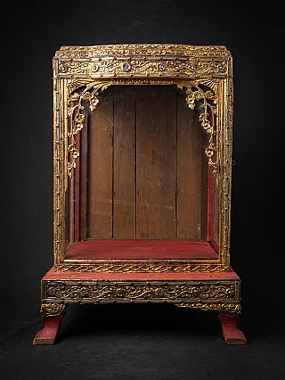 Burmese wooden Buddha shrine, full front view with gilded frame and red interior base