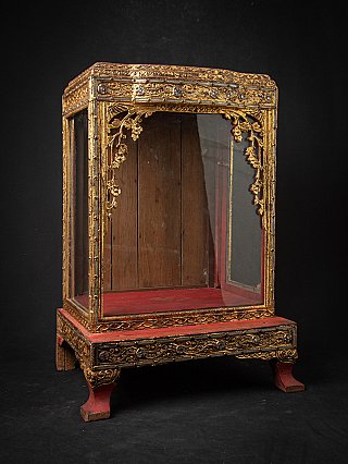 Burmese wooden Buddha shrine, three-quarter view highlighting the gilded floral arch trim