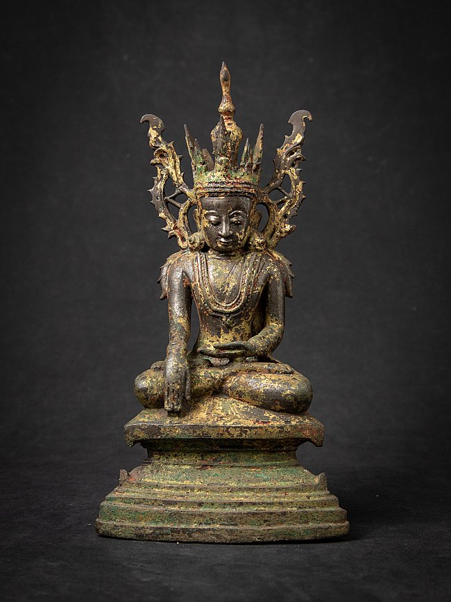 Burmese bronze Buddha statue seated, full front view with tall crown and green patina