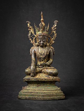 Burmese bronze Buddha statue seated, full front view with tall crown and green patina