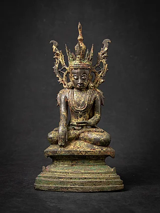 Burmese bronze Buddha statue seated, full front view with tall crown and green patina