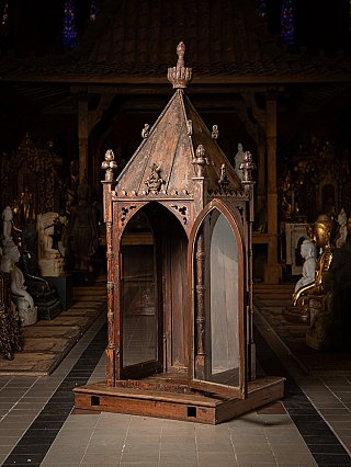Indian wooden temple shrine, three-quarter view with the glass door open