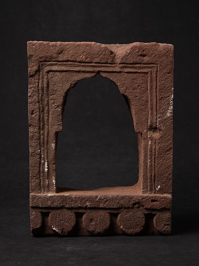 Indian stone temple niche with arched opening, front view
