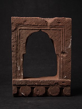 Indian stone temple niche with arched opening, front view