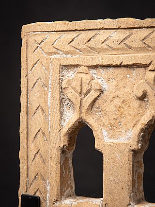 Detail of the top border with chevron motif and an arched opening below