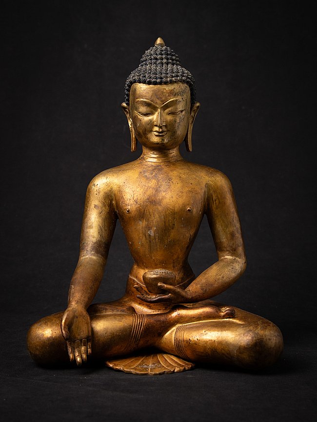Nepali bronze Buddha statue seated, full front view with varada mudra and bowl in left hand
